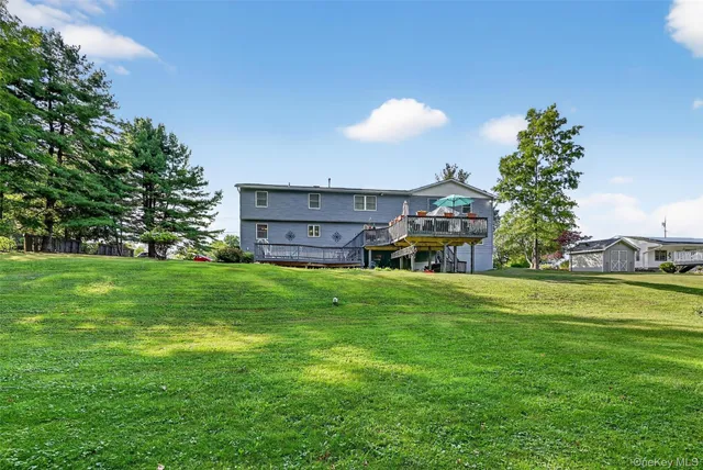 a view of a house with a back yard