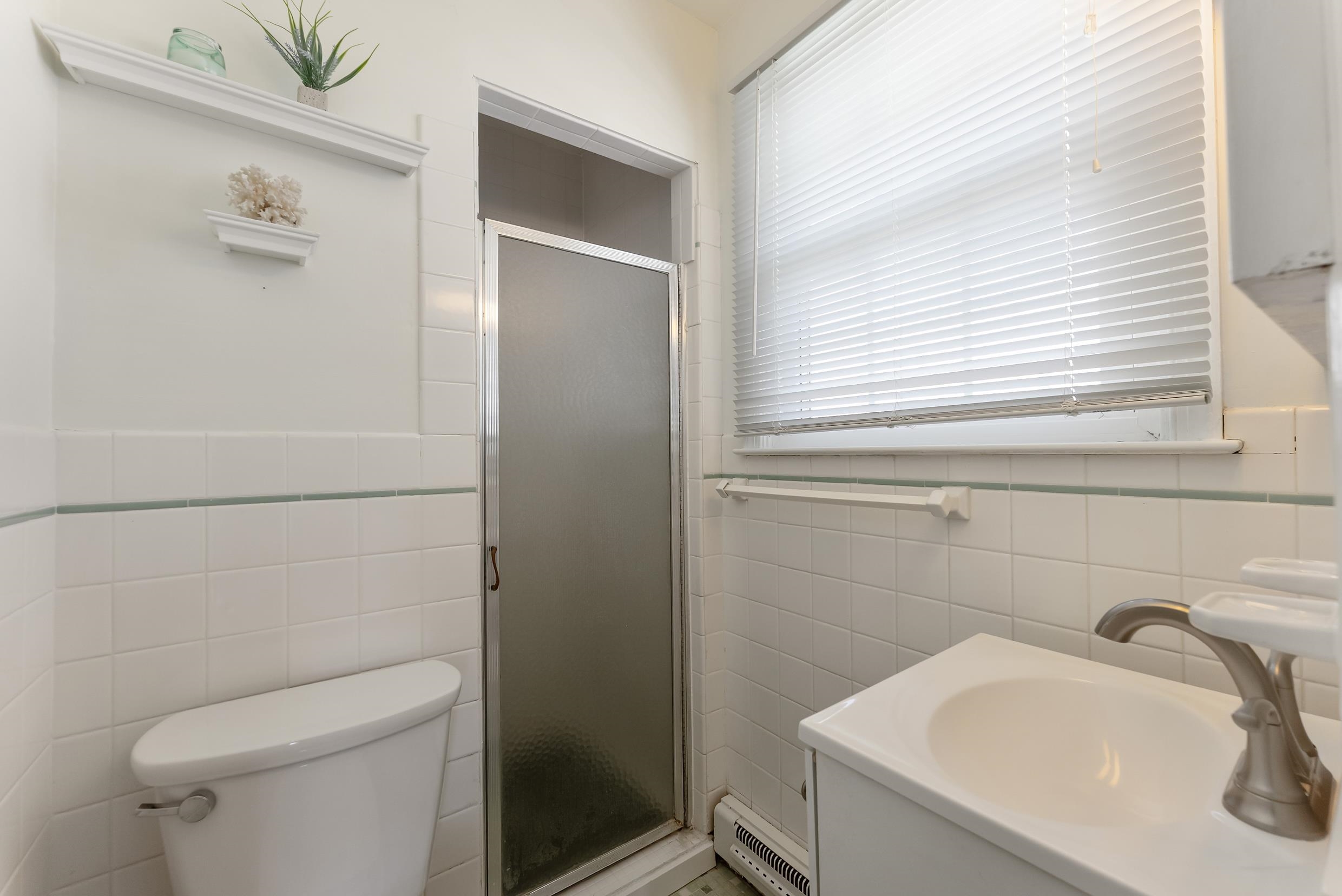 647 Barry Road Avalon, NJ 08202 - Photo 12 of 25 a bathroom with a sink a toilet and shower