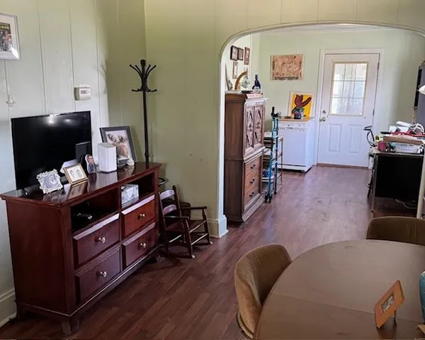 a room with furniture and wooden floor