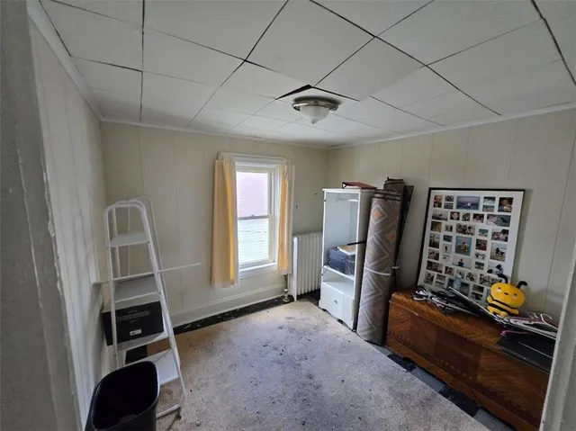 a view of room with furniture and windows