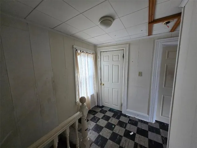 a bathroom with a sink toilet and window