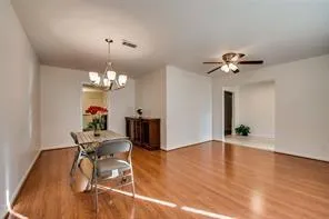 a view of a livingroom with furniture and chandelier