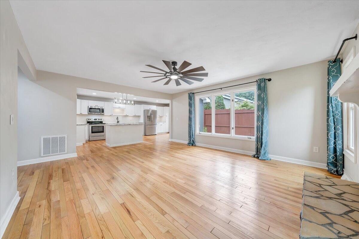422 Willow Creek Road Rocky Mount, VA 24151 - Photo 12 of 70 a view of empty room with wooden floor and fan