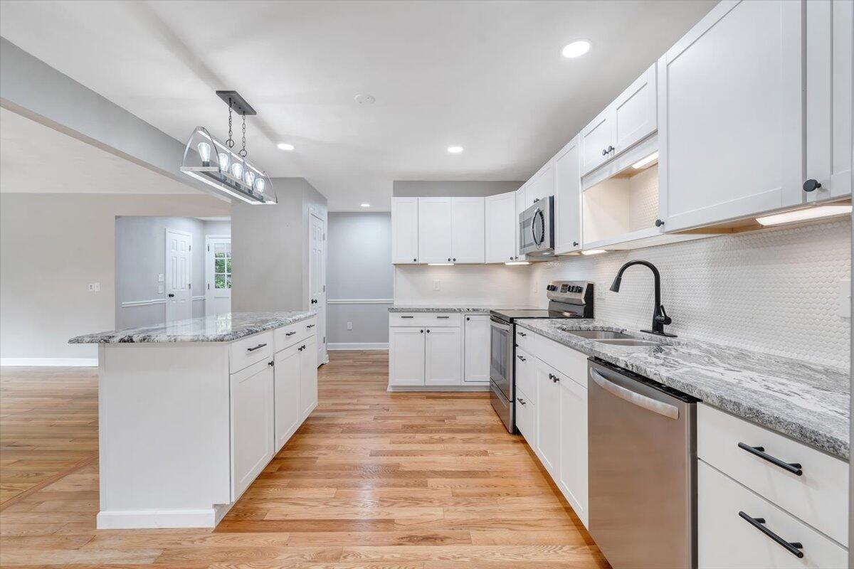 422 Willow Creek Road Rocky Mount, VA 24151 - Photo 24 of 70 a kitchen with granite countertop a sink and cabinets