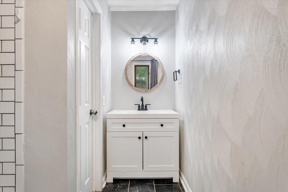 422 Willow Creek Road Rocky Mount, VA 24151 - Photo 29 of 70 a bathroom with a sink and a mirror