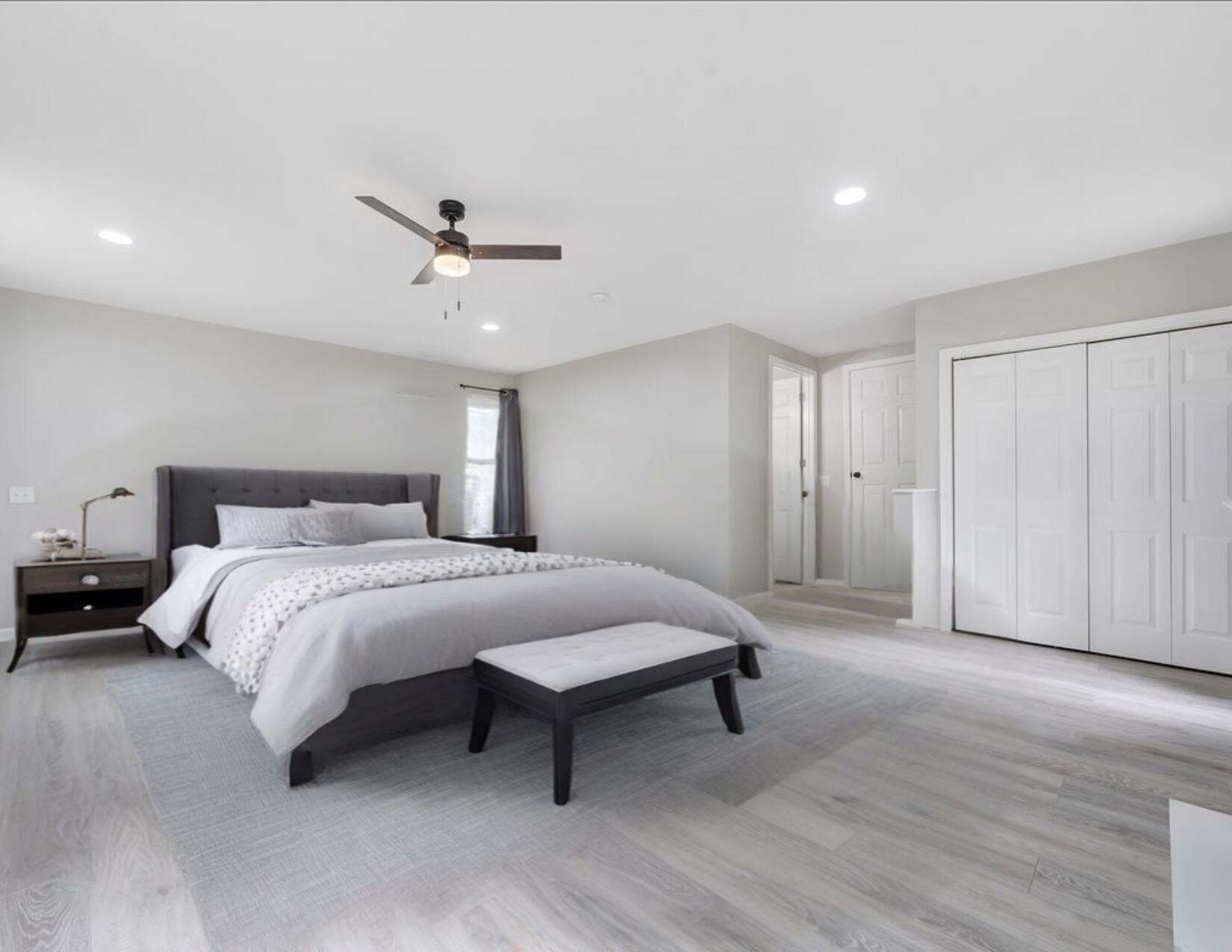 422 Willow Creek Road Rocky Mount, VA 24151 - Photo 31 of 70 a spacious bedroom with a bed and a ceiling fan