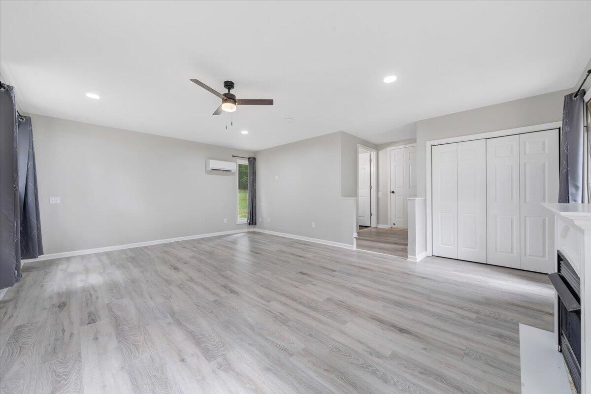 422 Willow Creek Road Rocky Mount, VA 24151 - Photo 35 of 70 a view of empty room with wooden floor and ceiling fan