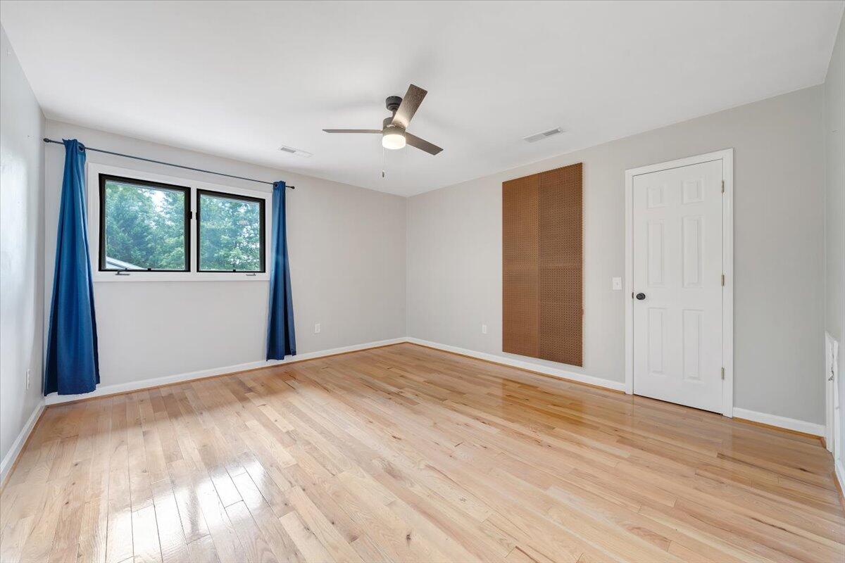 422 Willow Creek Road Rocky Mount, VA 24151 - Photo 40 of 70 a view of a bedroom with wooden floor and windows