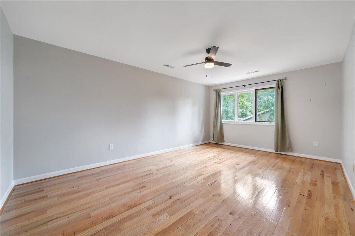 422 Willow Creek Road Rocky Mount, VA 24151 - Photo 42 of 70 wooden floor in an empty room with a window
