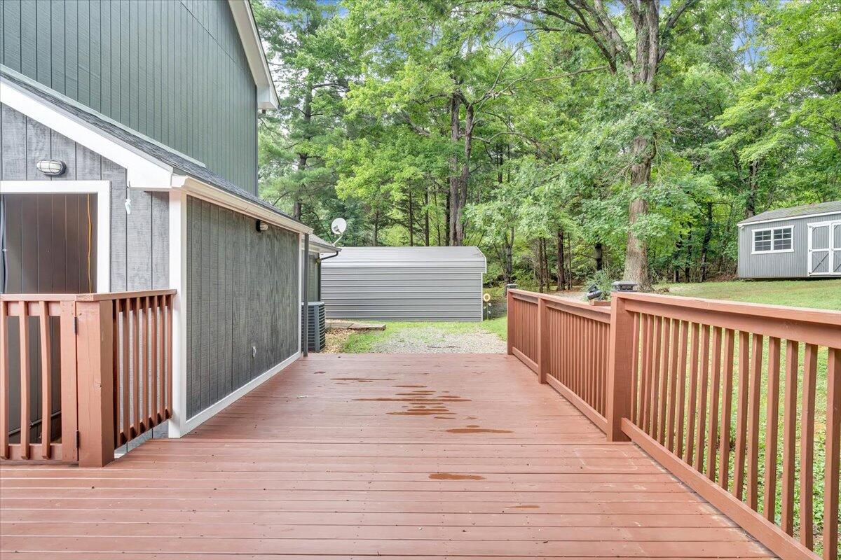 422 Willow Creek Road Rocky Mount, VA 24151 - Photo 54 of 70 a view of a wooden deck and a backyard