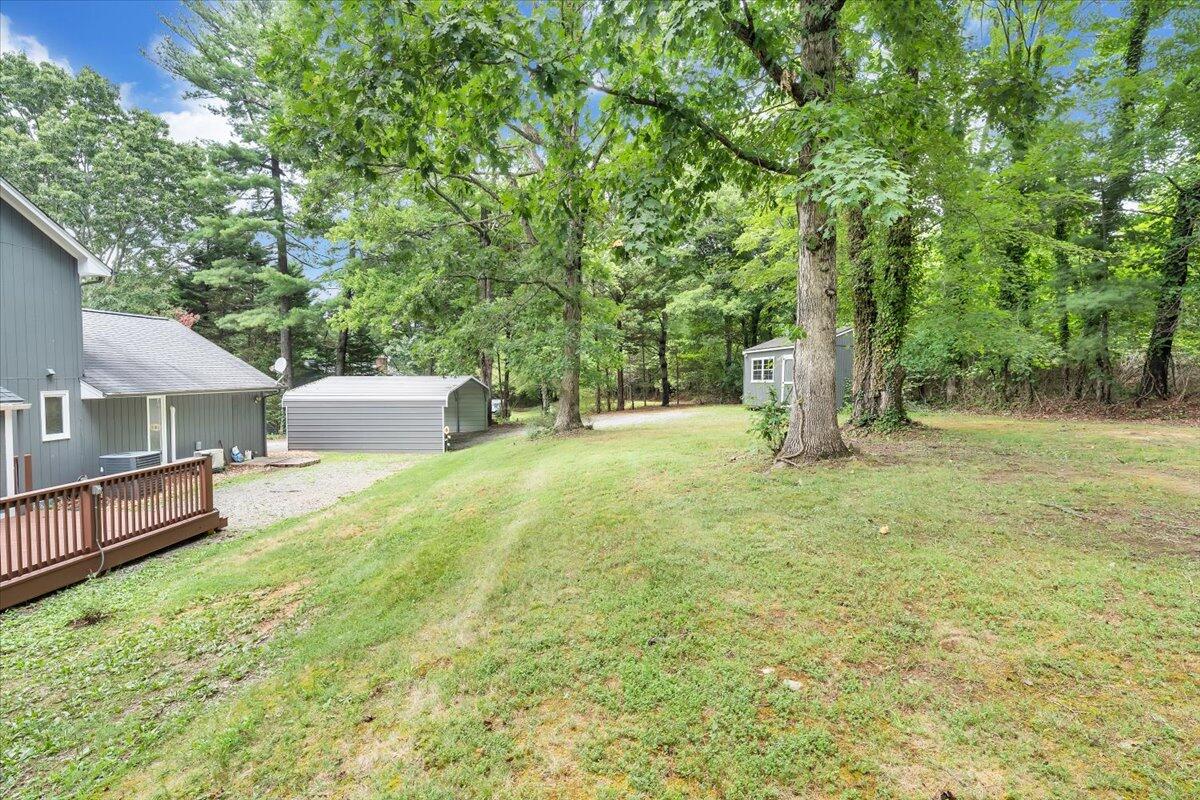 422 Willow Creek Road Rocky Mount, VA 24151 - Photo 61 of 70 a backyard of a house with oven and tree