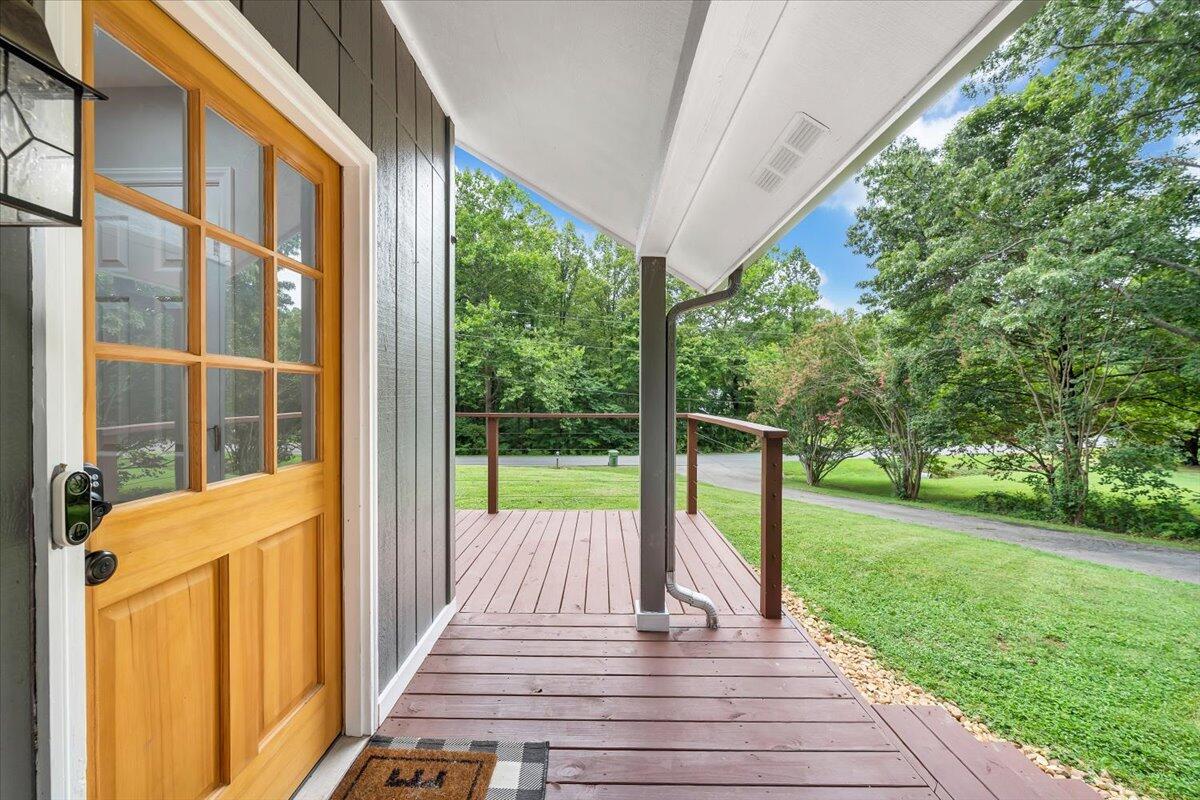 422 Willow Creek Road Rocky Mount, VA 24151 - Photo 63 of 70 a view of a deck with a big yard potted plants and large tree