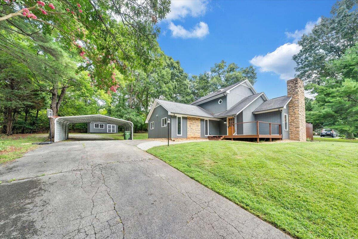 422 Willow Creek Road Rocky Mount, VA 24151 - Photo 66 of 70 a front view of a house with a garden and trees