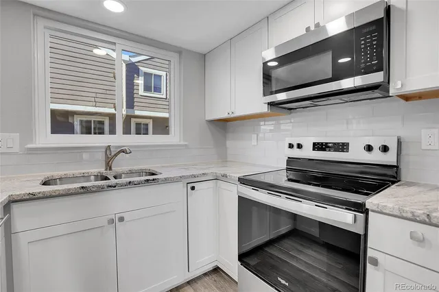 a kitchen with a stove and a microwave