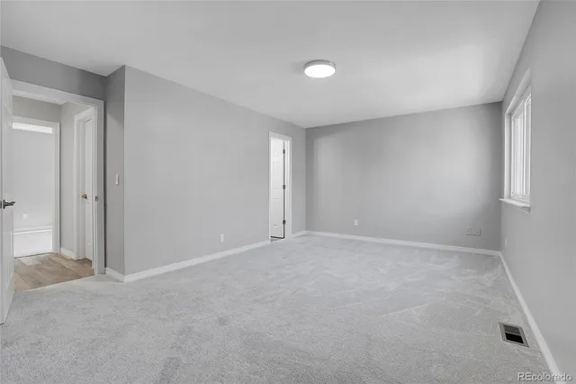 a view of an empty room and window