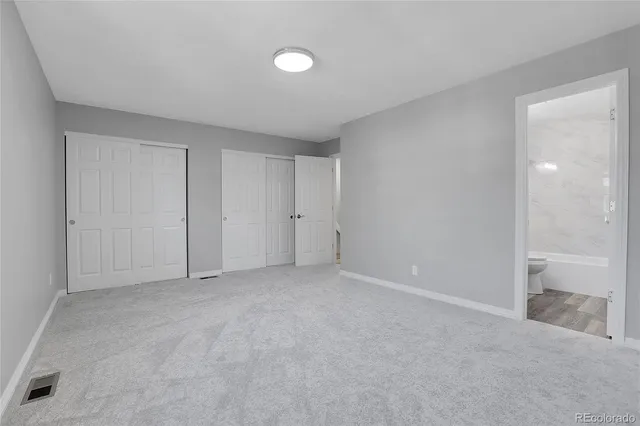 a view of an empty room and closet