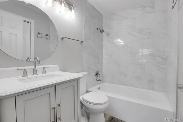 a bathroom with a sink a toilet and a bathtub