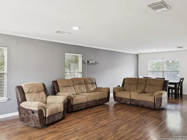 a view of a livingroom with furniture and window