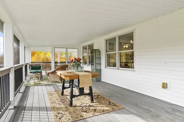 a view of outdoor space with wooden floor