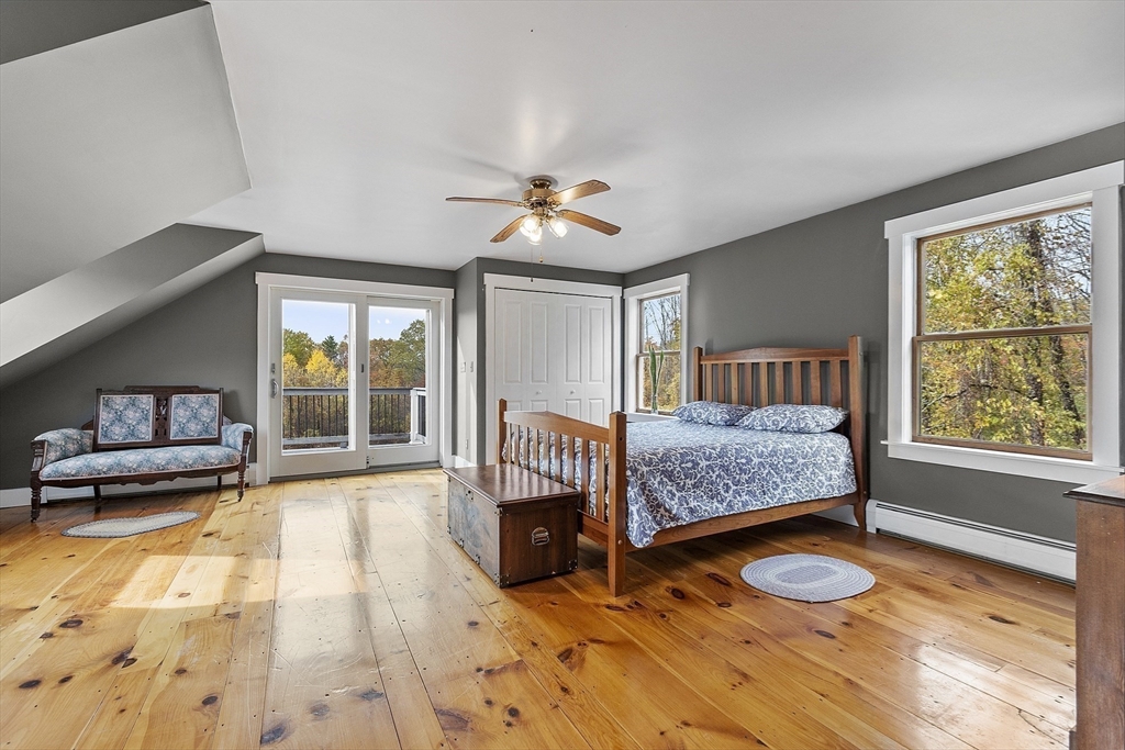 4 Elm Avenue Royalston, MA 01368 - Photo 28 of 42 a bedroom with a bed and a large window with outer view