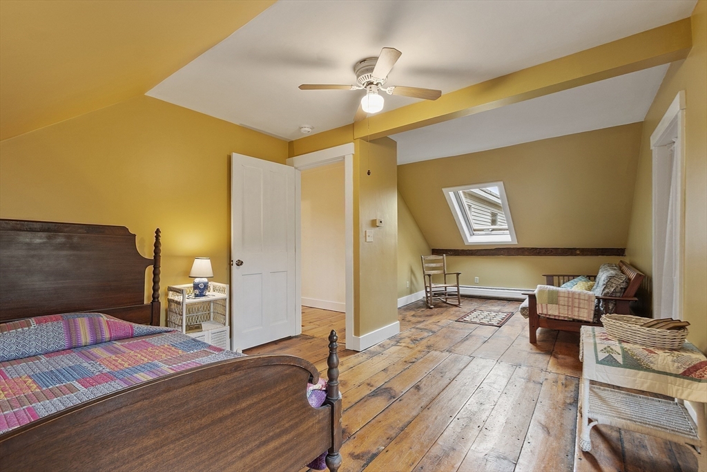 4 Elm Avenue Royalston, MA 01368 - Photo 36 of 42 a bedroom with a bed and wooden floor