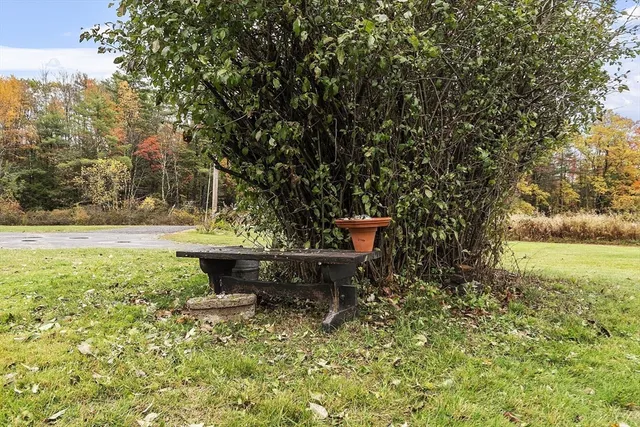a view of a yard with table and chairs