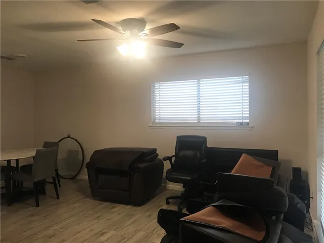 a living room with furniture and a window