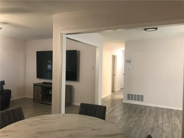 a bedroom with a bed and a television in it