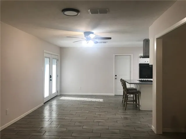 a view of a livingroom with a kitchen