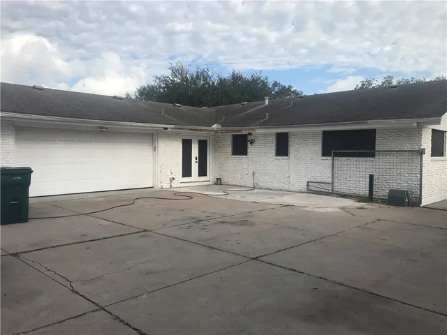 a view of garage and yard