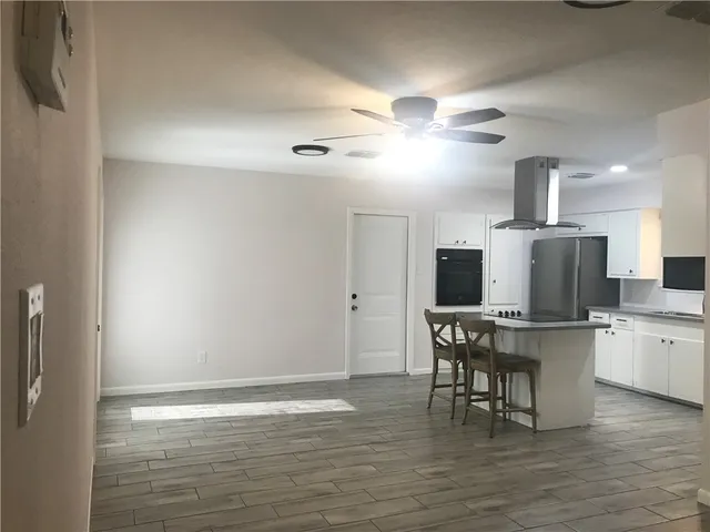 a view of kitchen with breakfast area