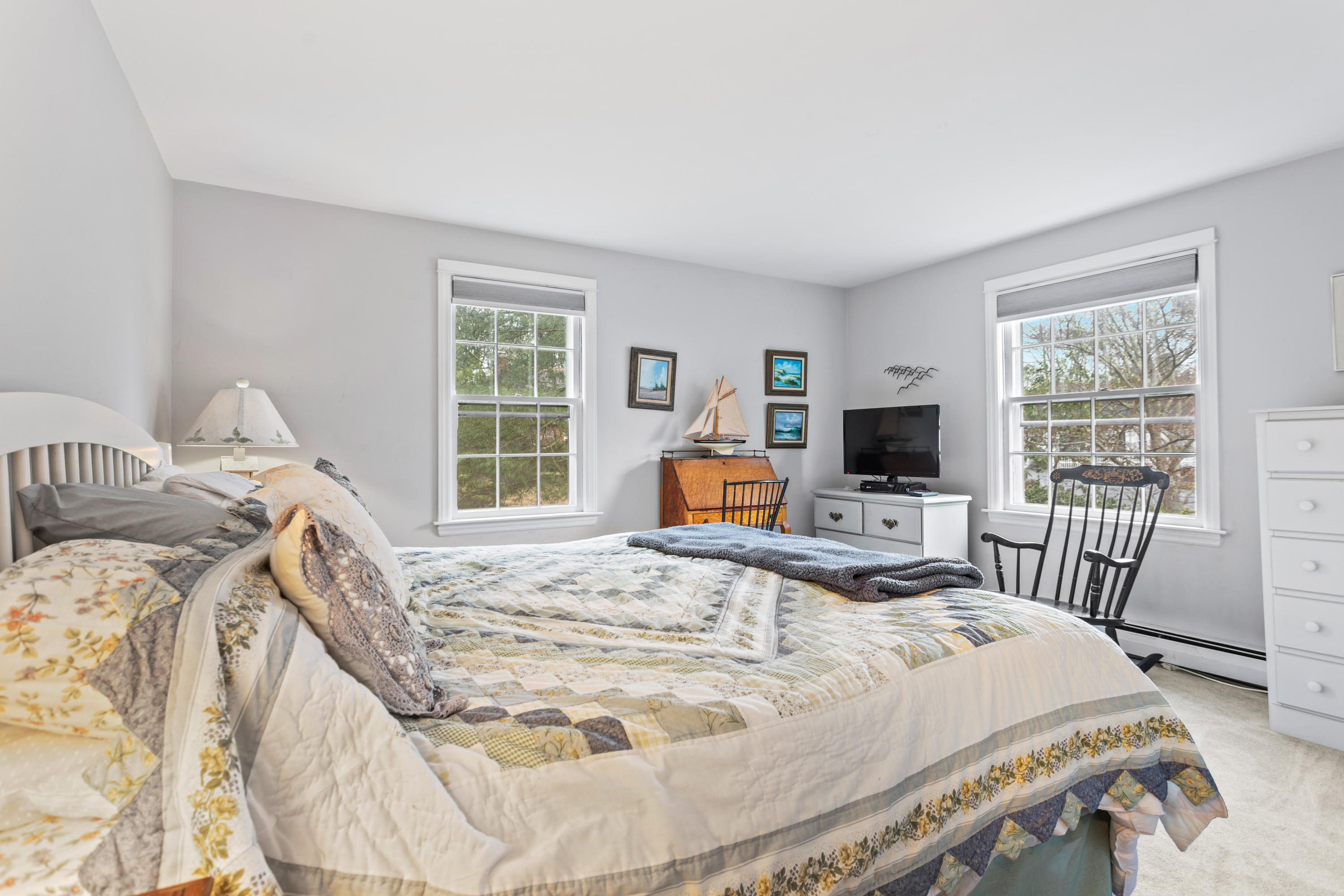 6 Padlock Lane Centerville, MA 02632 - Photo 14 of 29 a bedroom with a bed a flat screen tv and windows