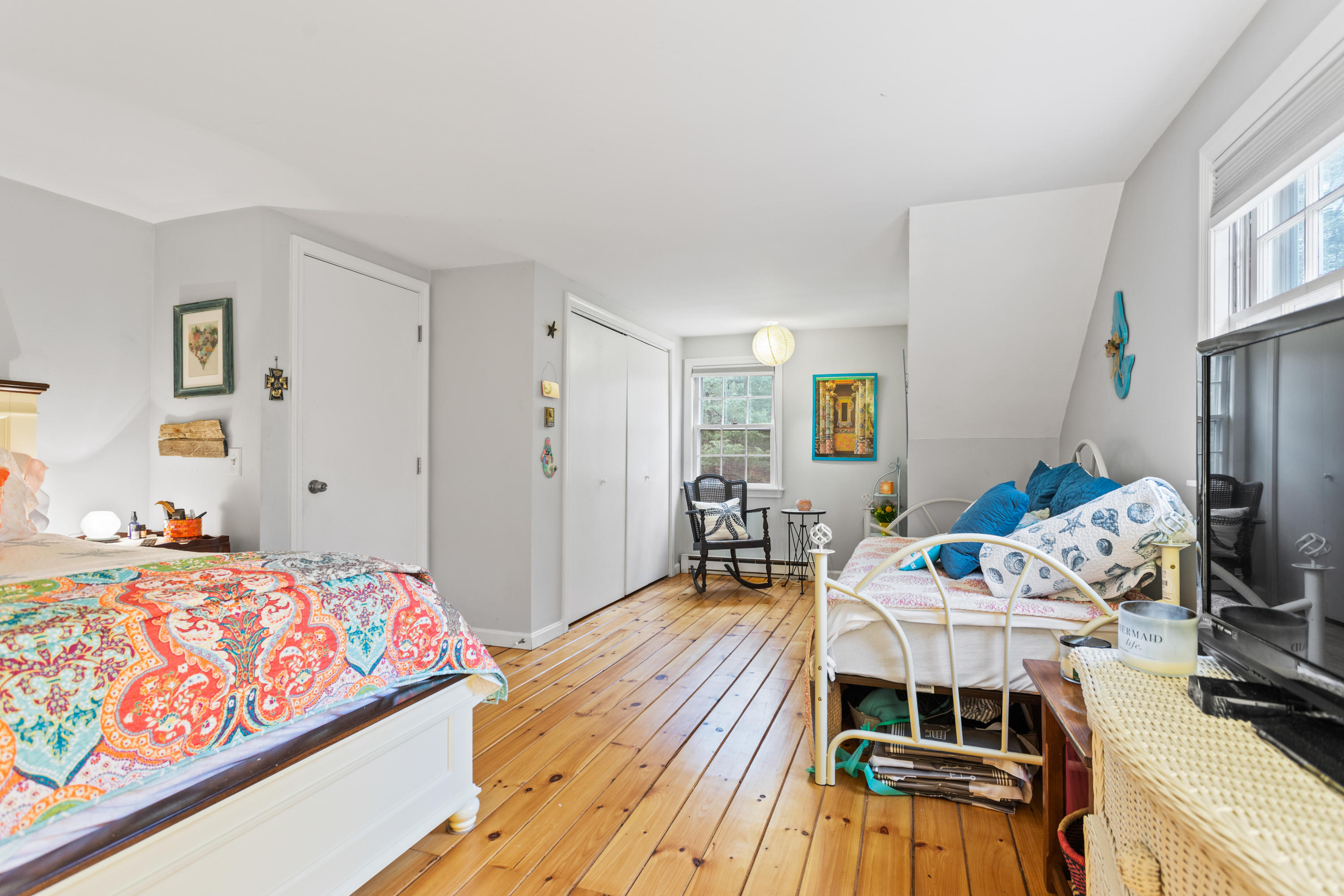 6 Padlock Lane Centerville, MA 02632 - Photo 18 of 29 a bedroom with a bed and a wooden floor