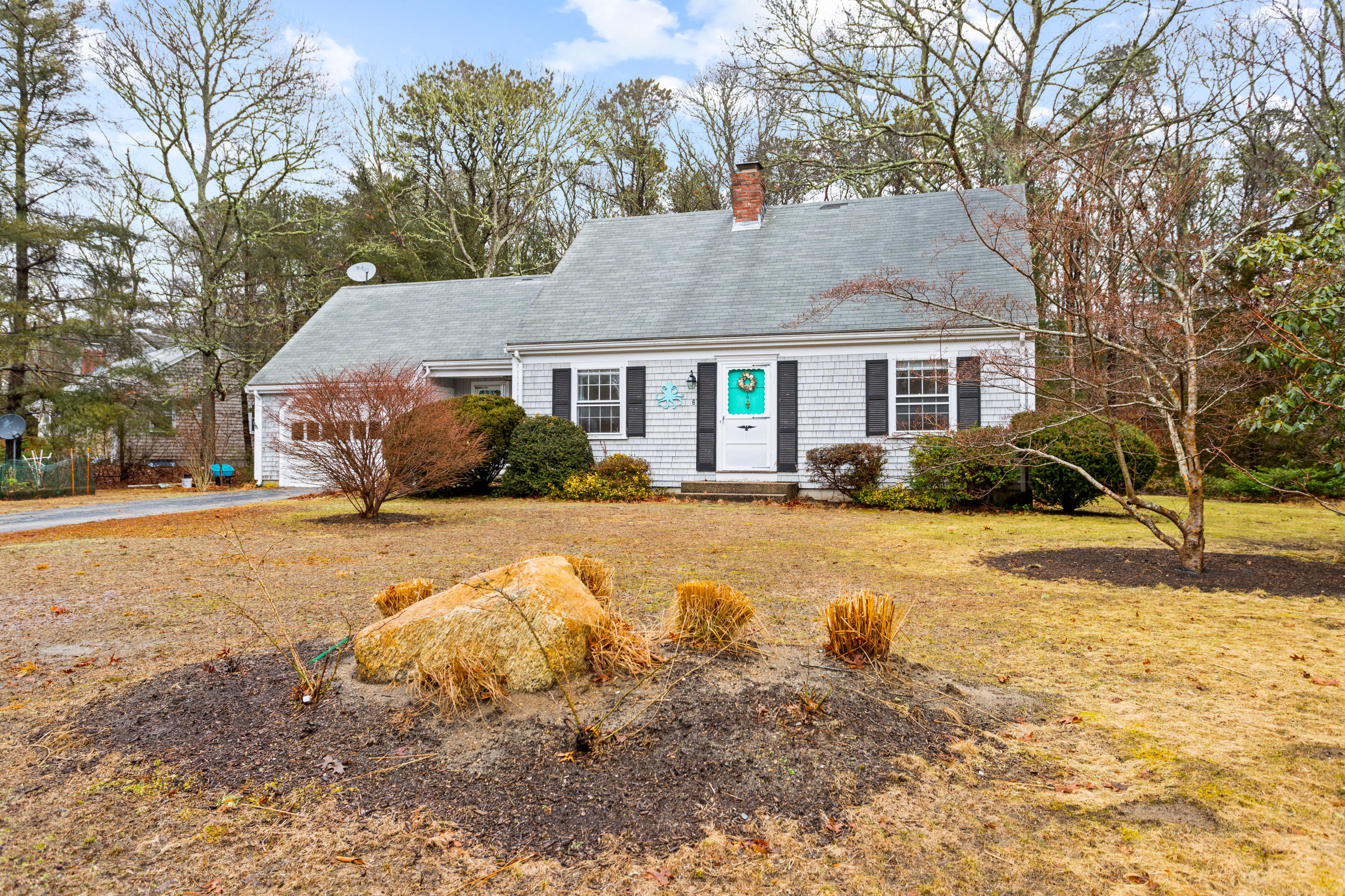 6 Padlock Lane Centerville, MA 02632 - Photo 2 of 29 a front view of house with yard and trees around