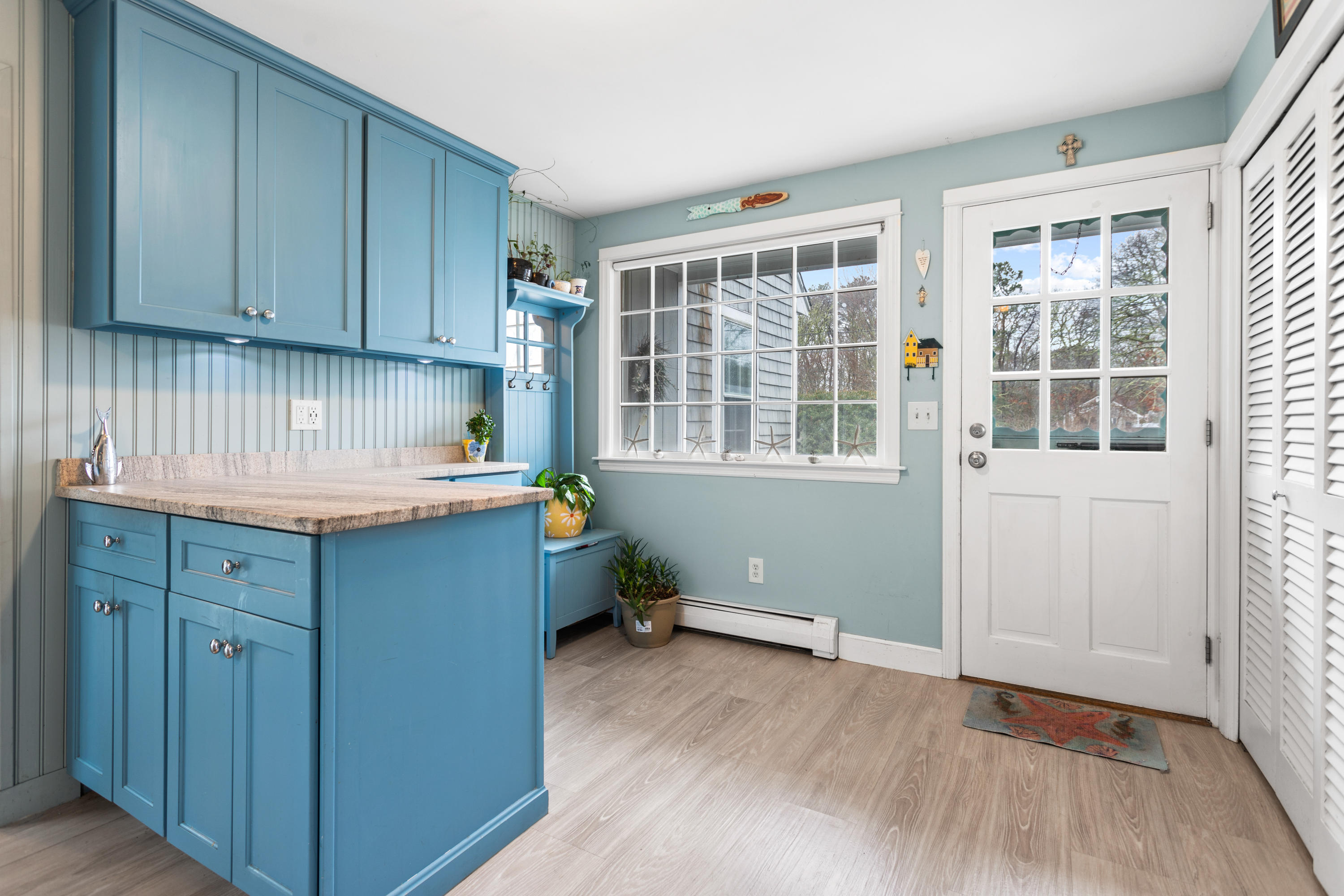 6 Padlock Lane Centerville, MA 02632 - Photo 5 of 29 an empty room with wooden floor and cabinet