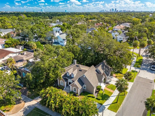 an aerial view of a house with a lake view
