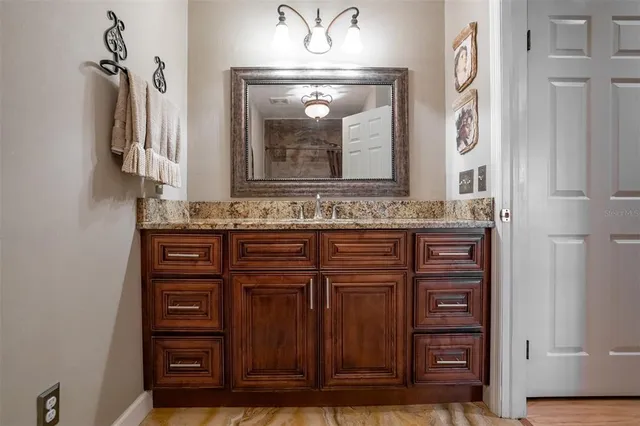 a view of a house with backyard sitting area and furniture