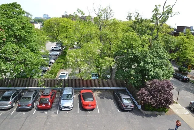 a view of a chair and tables in the back yard of the house