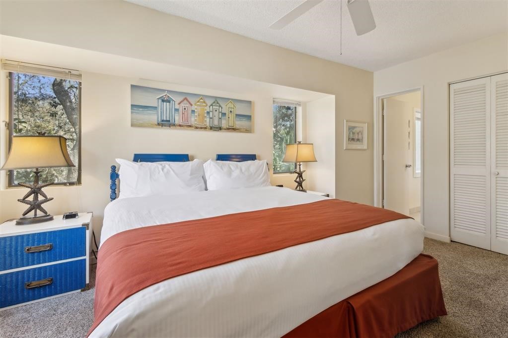 2004 Beachwood Road, Unit 2004 Fernandina Beach, FL 32034 - Photo 35 of 54 a bedroom with a bed and wooden floor