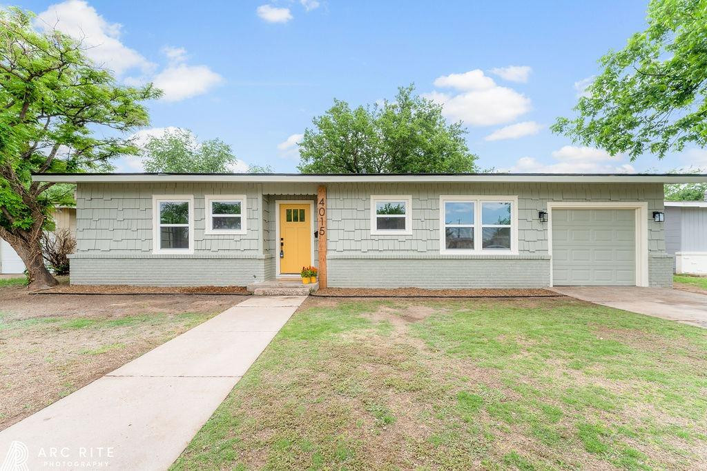 front view of a house with a yard