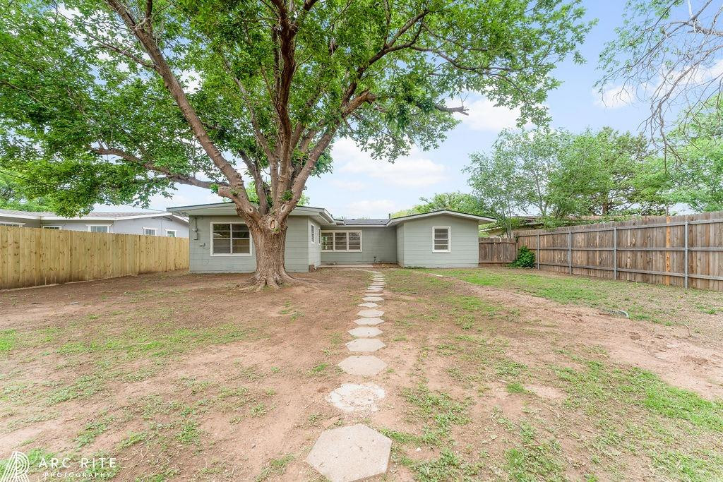 4015 37th Street Lubbock, TX 79413 - Photo 30 of 30 a front view of a house with a yard and garage