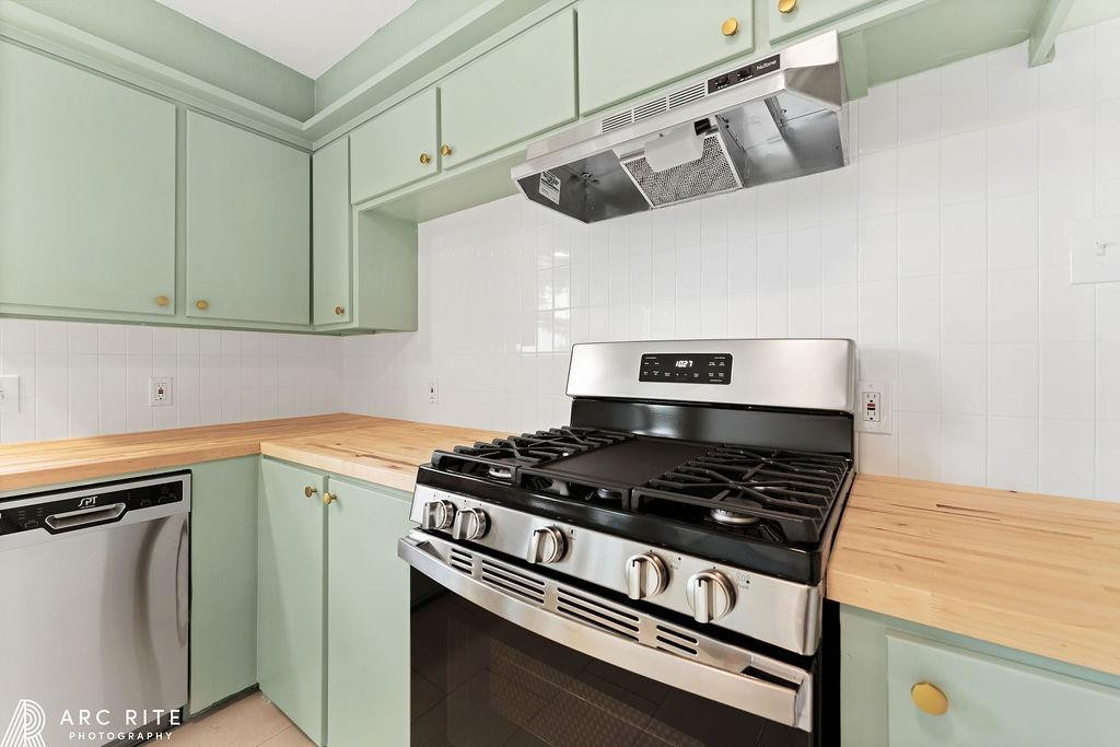 4015 37th Street Lubbock, TX 79413 - Photo 7 of 30 a kitchen with granite countertop a stove and a sink