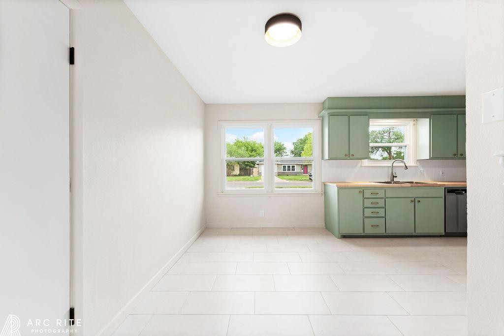 4015 37th Street Lubbock, TX 79413 - Photo 9 of 30 a bathroom with a mirror sink and window