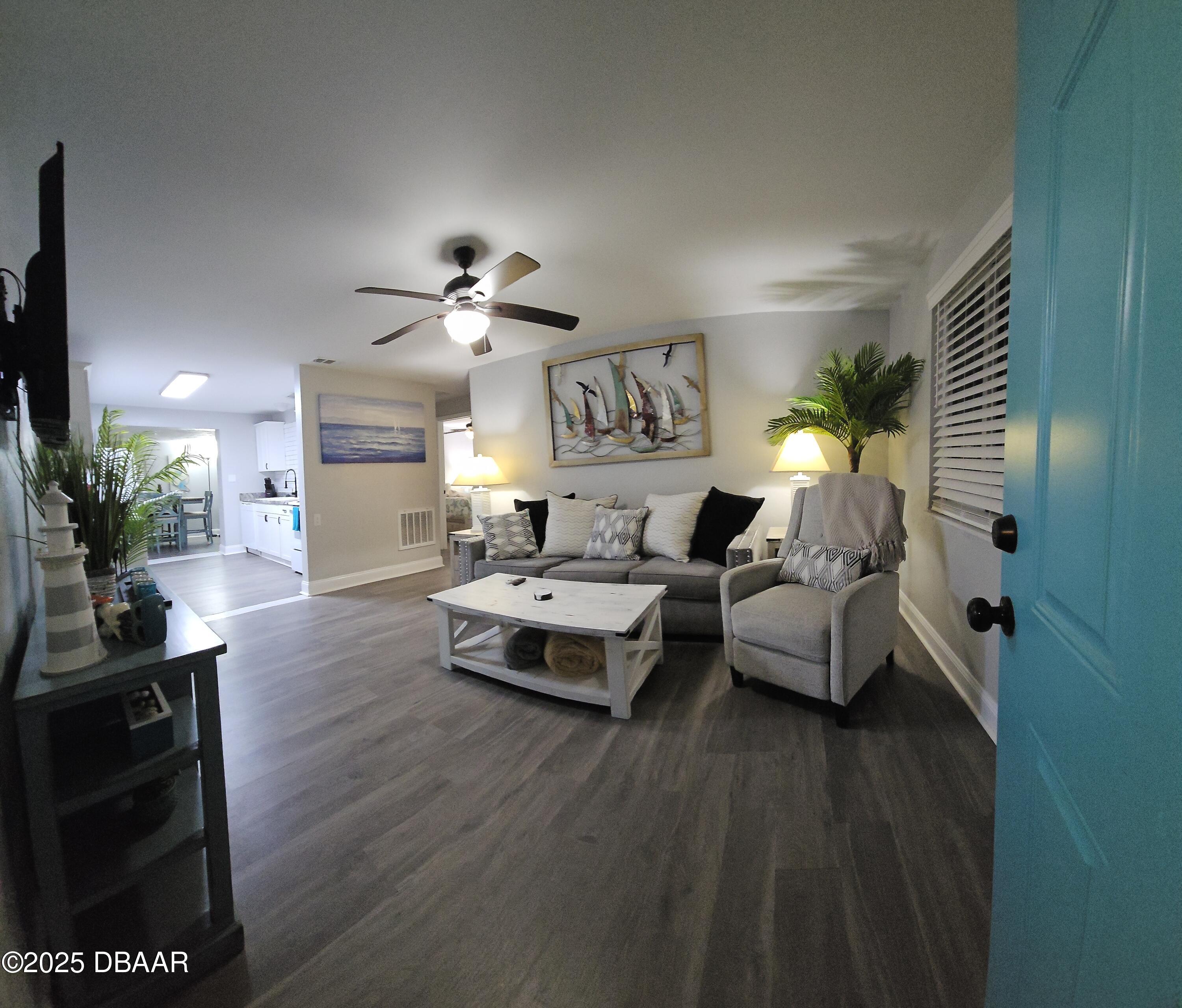 62 Rivershore Drive Ormond Beach, FL 32176 - Photo 11 of 27 a living room with furniture and a fireplace