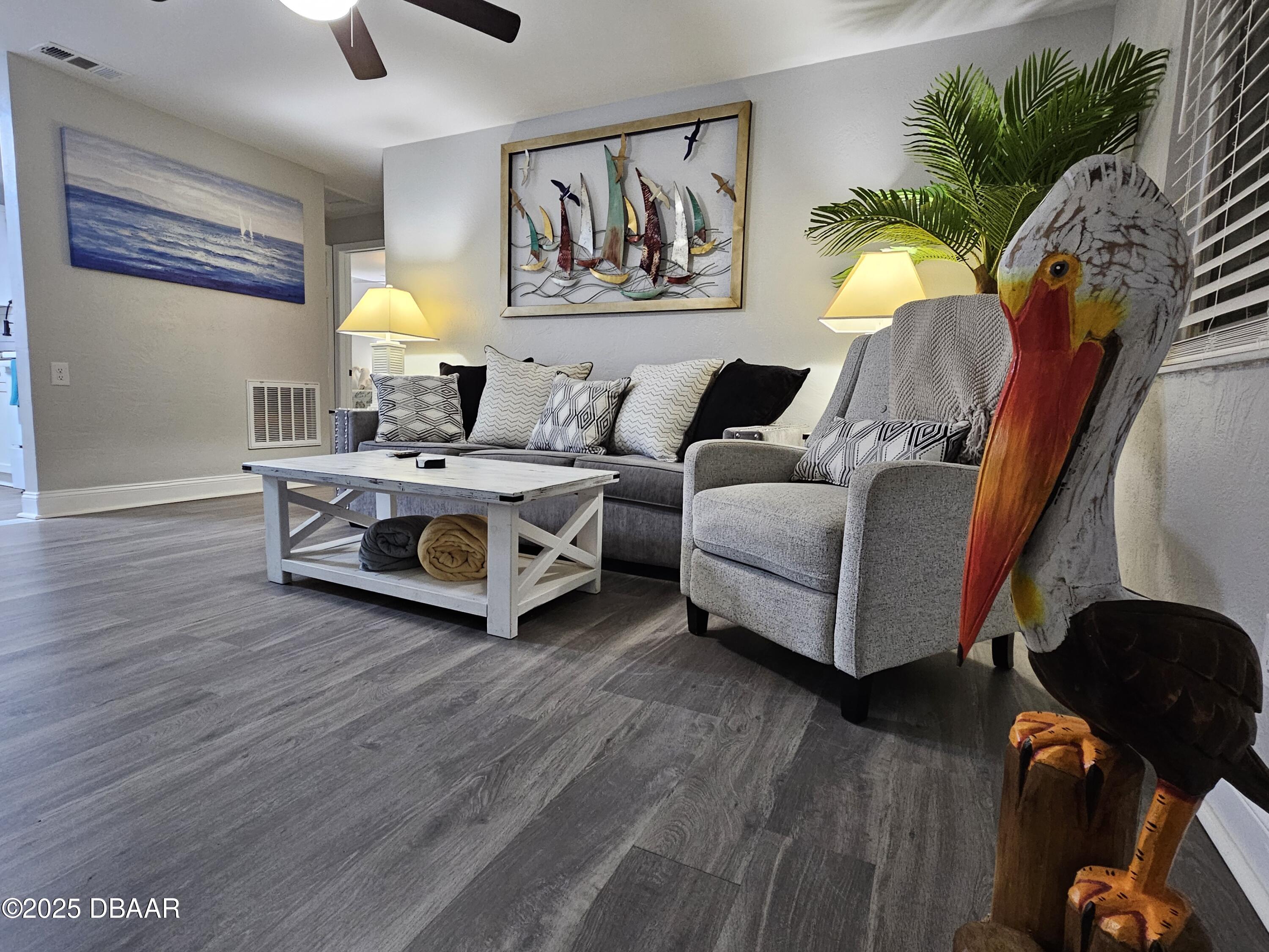 62 Rivershore Drive Ormond Beach, FL 32176 - Photo 12 of 27 a living room with furniture and a wooden floor