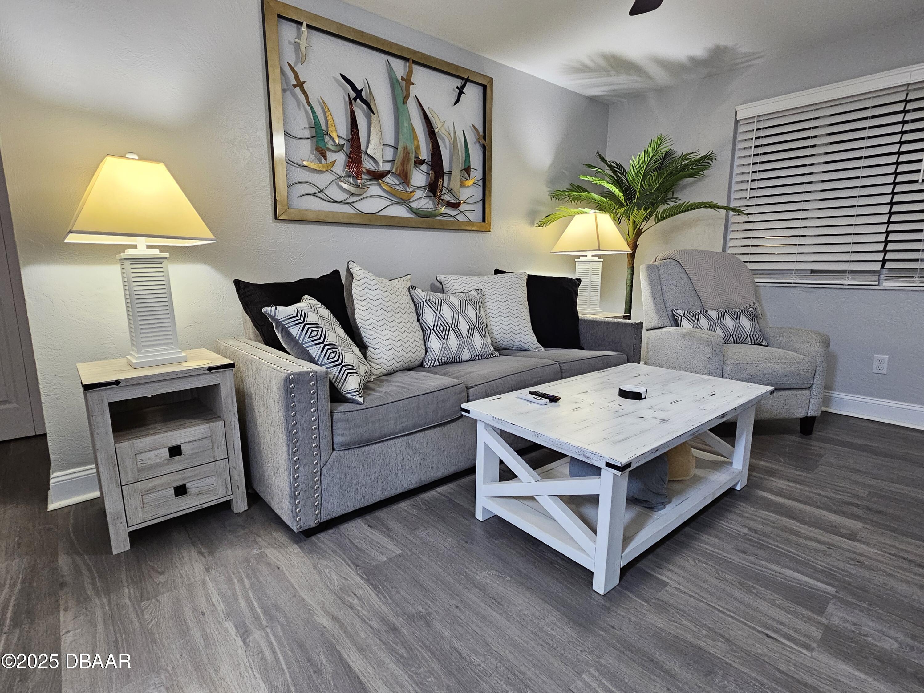 62 Rivershore Drive Ormond Beach, FL 32176 - Photo 13 of 27 a living room with furniture and a lamp