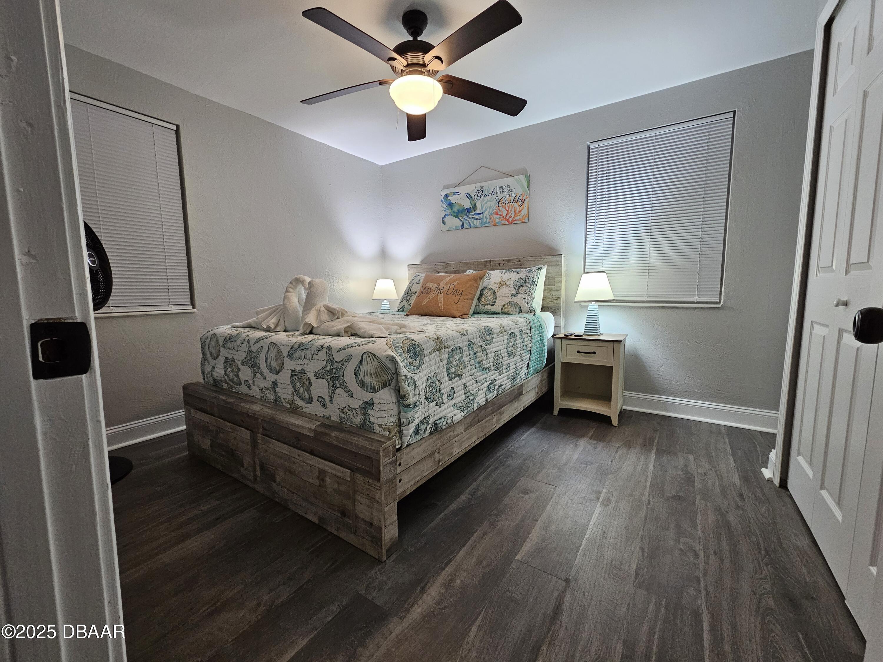 62 Rivershore Drive Ormond Beach, FL 32176 - Photo 18 of 27 a bedroom with a bed and a ceiling fan