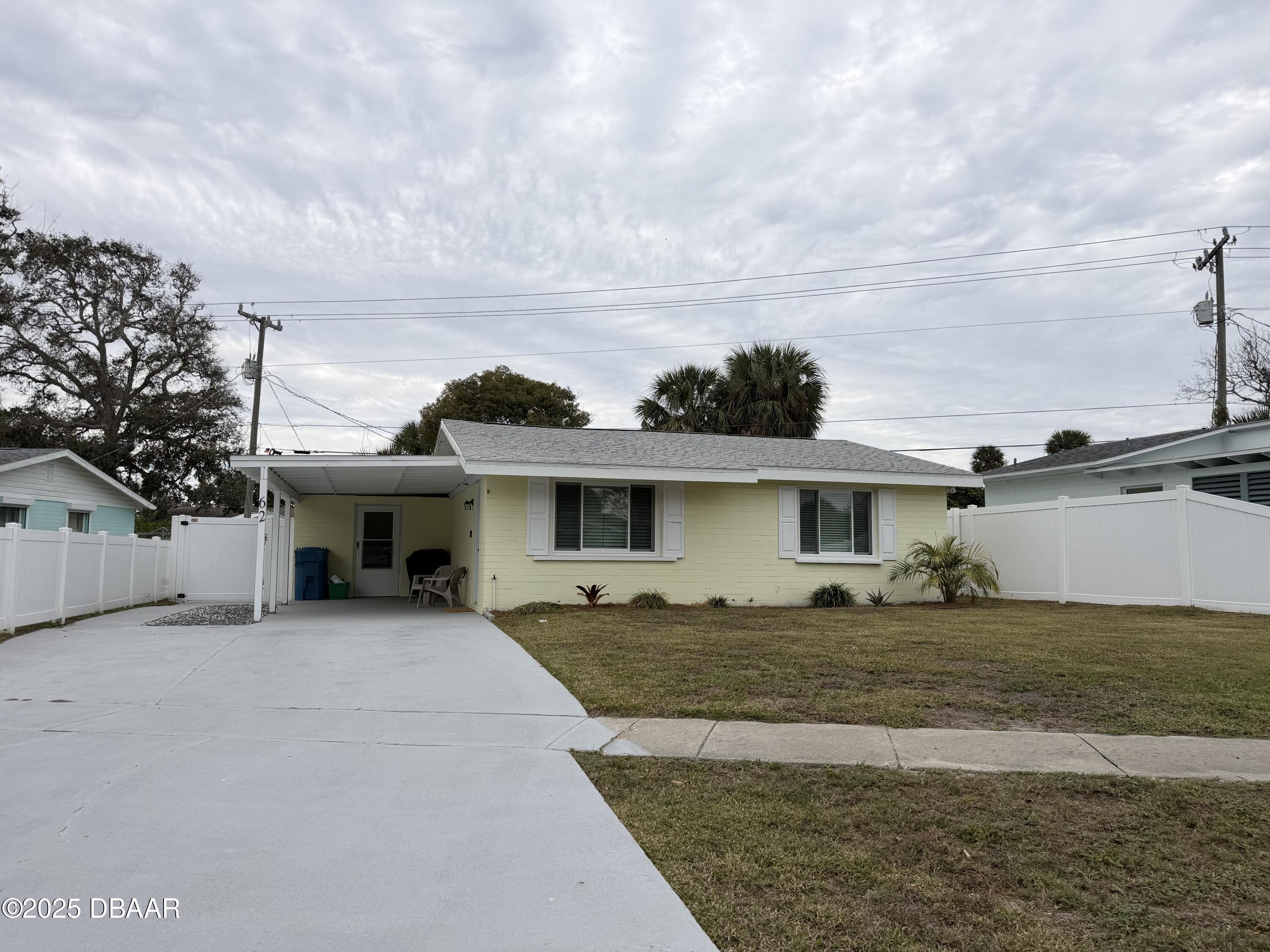 62 Rivershore Drive Ormond Beach, FL 32176 - Photo 27 of 27 a front view of a house with a yard