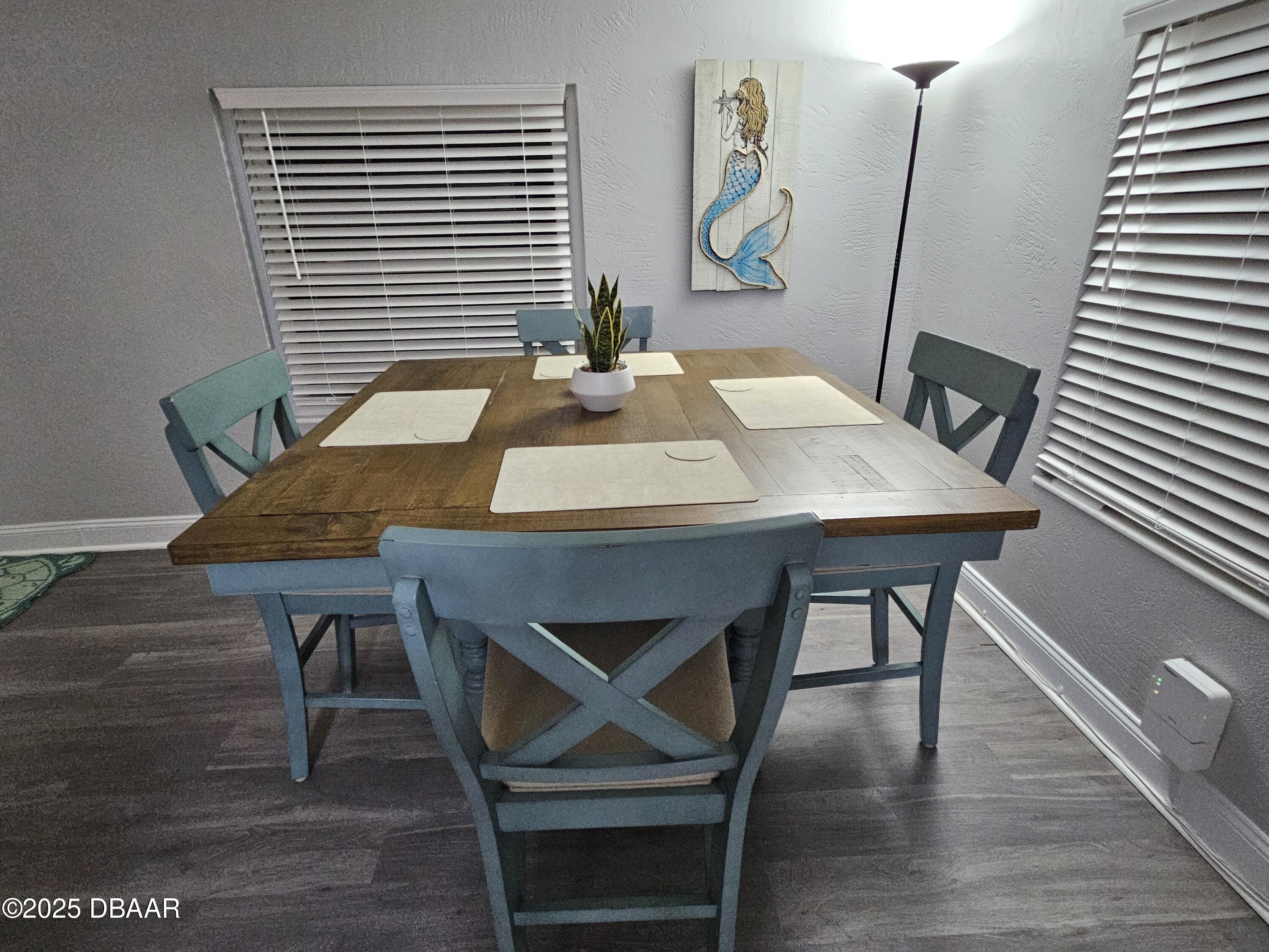 62 Rivershore Drive Ormond Beach, FL 32176 - Photo 5 of 27 a view of a dining room with furniture and wooden floor