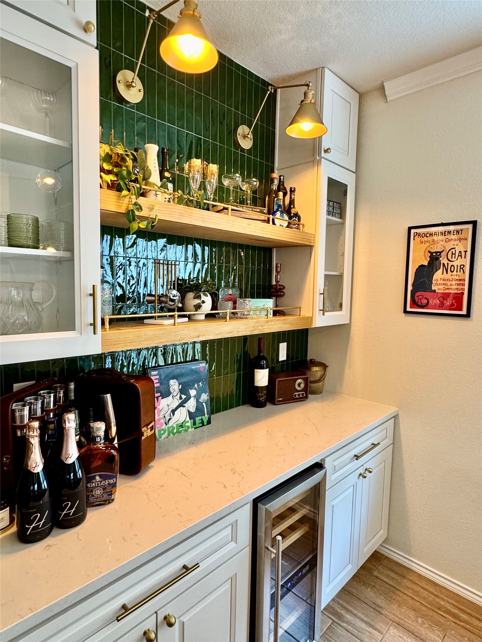 1017 Cliffbrake Way Georgetown, TX 78626 - Photo 2 of 21 Bar area featuring white cabinets, wine cooler, light stone counters, glass fronted cabinets, and a textured ceiling